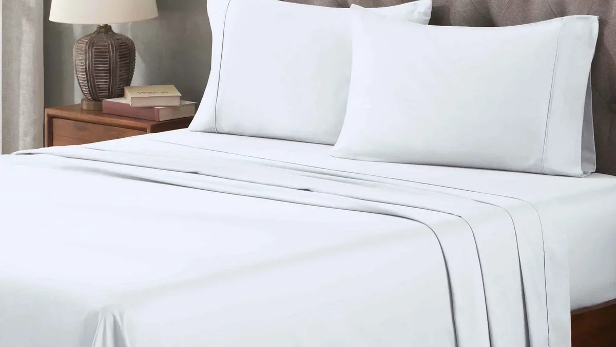 Superior 400 thread count Egyptian cotton sheet set in white on a made bed