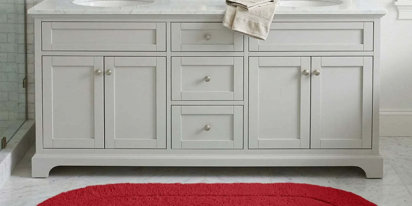 Superior oval cotton bath rug runner on a bathroom floor beside a double vanity