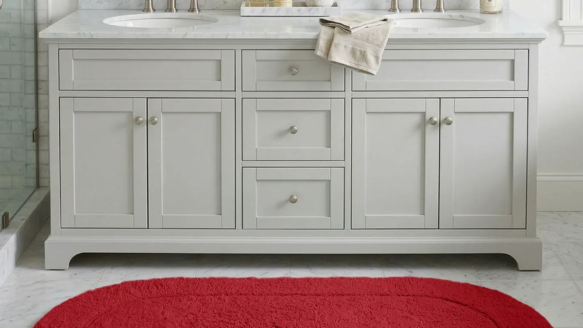 Superior cotton bath rug on the floor of a bright bathroom with a double vanity